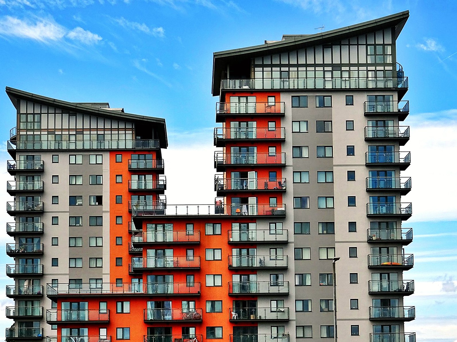 Modern apartment buildings against a blue sky